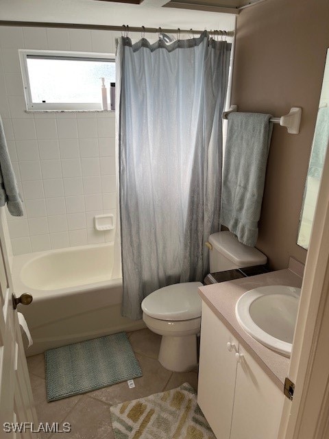 full bathroom featuring vanity, shower / bath combination with curtain, toilet, and tile patterned flooring