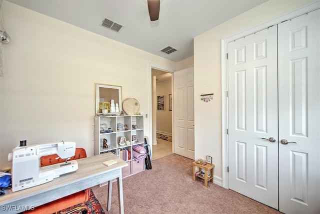 office area with carpet and ceiling fan