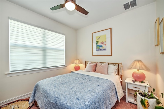 bedroom featuring ceiling fan and multiple windows