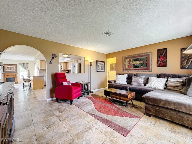 living room with a textured ceiling