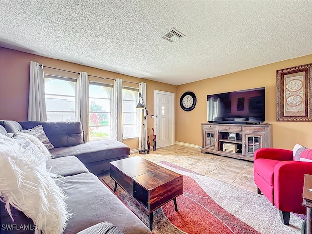 living room featuring a textured ceiling