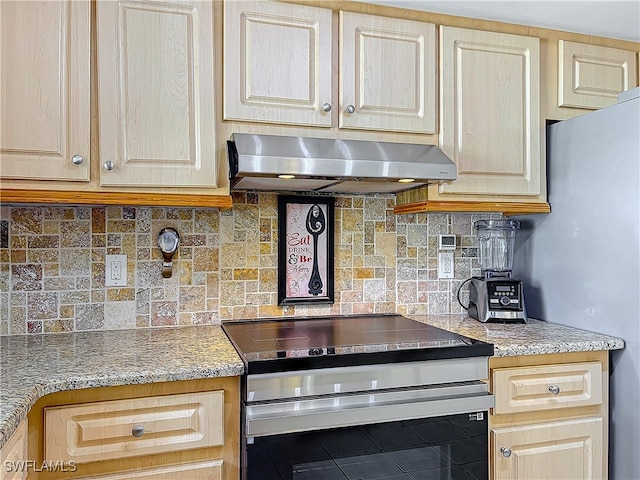 kitchen with tasteful backsplash, tile patterned flooring, light brown cabinets, and appliances with stainless steel finishes