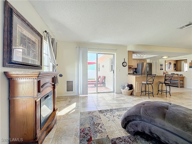 living room with a textured ceiling