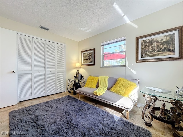 living room with a textured ceiling