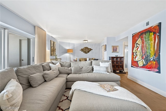 living room with light hardwood / wood-style floors