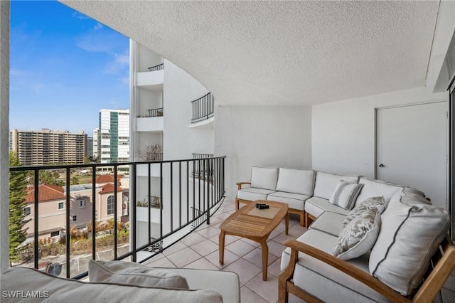 balcony featuring a city view and an outdoor living space