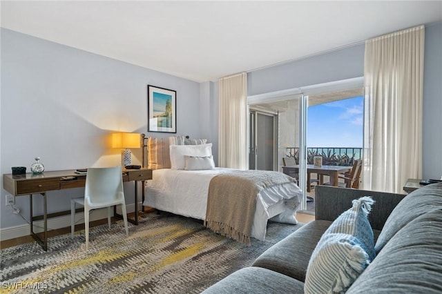 bedroom with dark hardwood / wood-style flooring