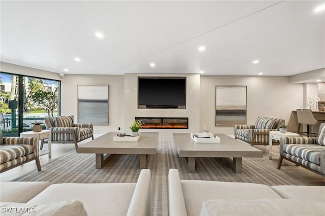 living room featuring a large fireplace