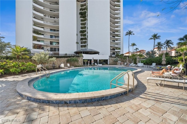 view of pool featuring a patio area