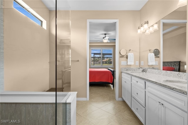 bathroom featuring tile patterned flooring, ceiling fan, a healthy amount of sunlight, and vanity