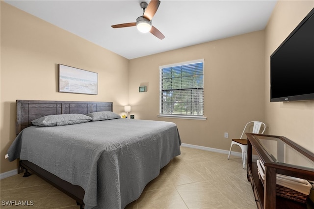 bedroom with ceiling fan and light tile patterned flooring