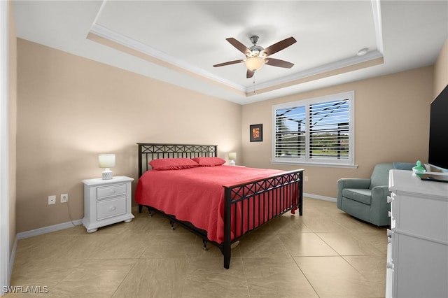 bedroom with a raised ceiling, ceiling fan, light tile patterned flooring, and ornamental molding