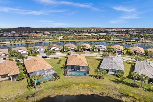 drone / aerial view with a water view