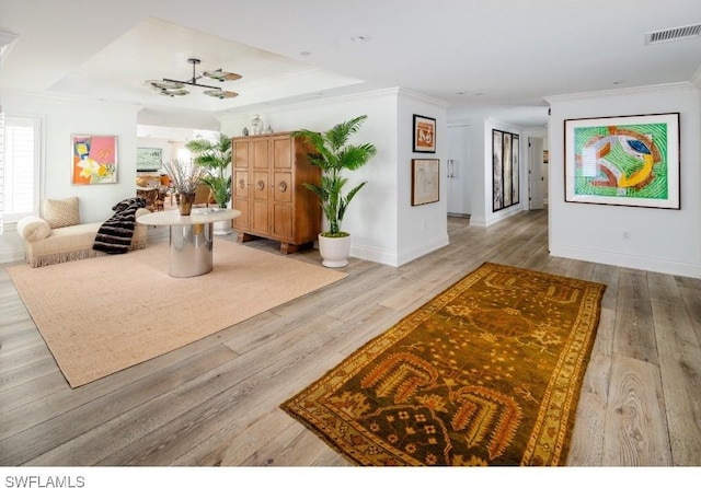 370 11th Ave S Unit 2, Naples, FL 34102 - living area with ornamental molding and light wood-style floors
