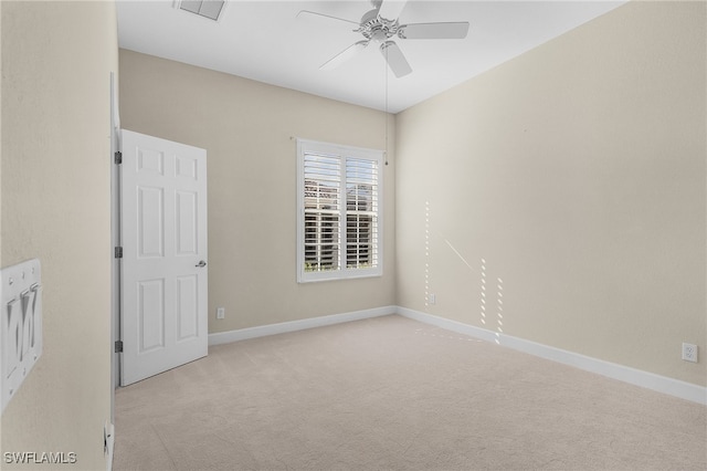 carpeted empty room with ceiling fan