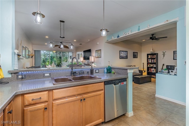 kitchen featuring dishwasher, sink, light tile patterned flooring, pendant lighting, and ceiling fan