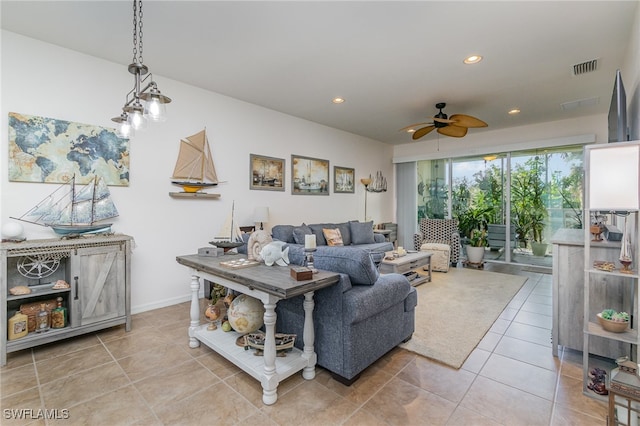 living room with light tile patterned floors and ceiling fan