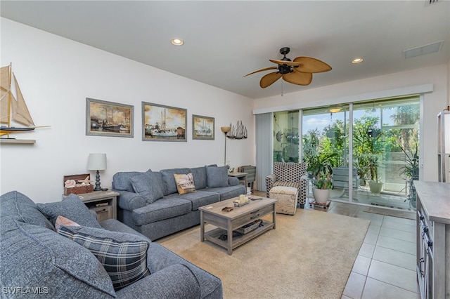 tiled living room featuring ceiling fan