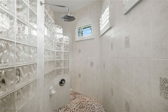 bathroom with a tile shower