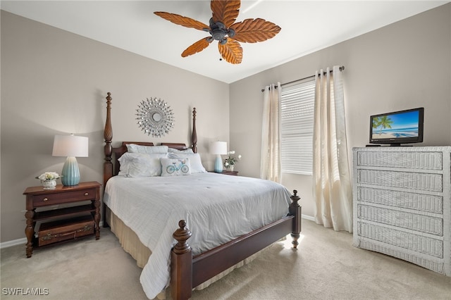 bedroom featuring light colored carpet and ceiling fan