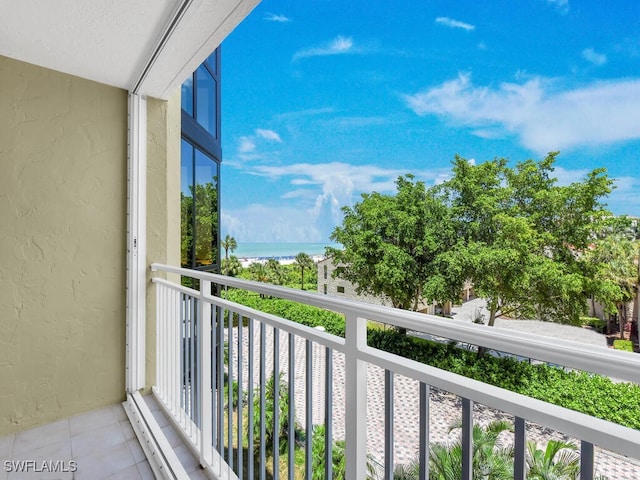 balcony featuring a water view