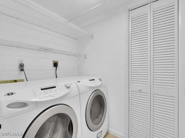 washroom with independent washer and dryer