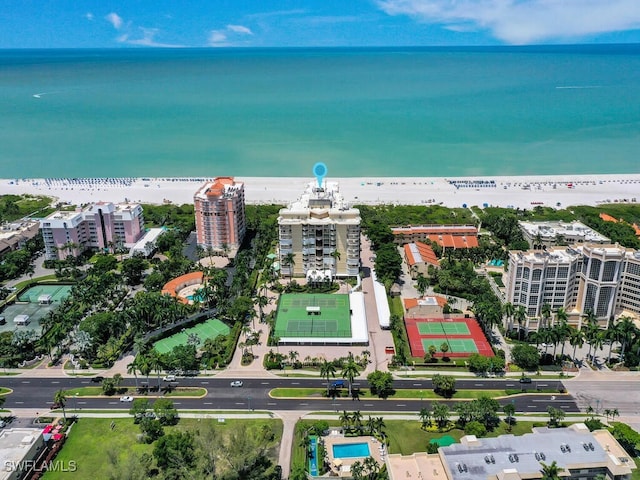 drone / aerial view with a water view and a view of the beach