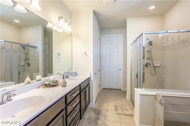 bathroom featuring vanity, walk in shower, and tile patterned flooring