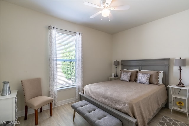 bedroom with ceiling fan and light hardwood / wood-style floors