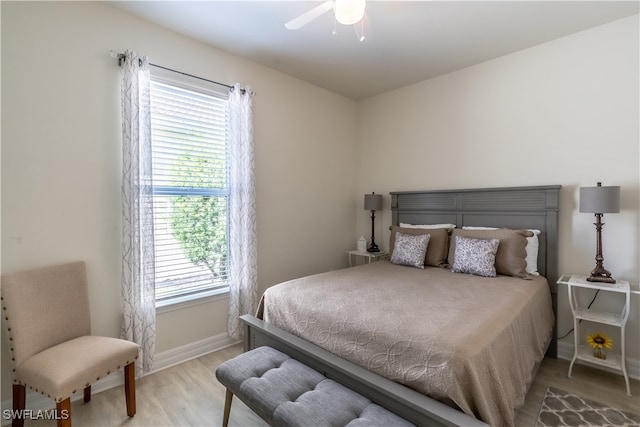 bedroom with light hardwood / wood-style floors and ceiling fan