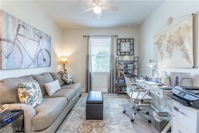 office area with light hardwood / wood-style floors and ceiling fan