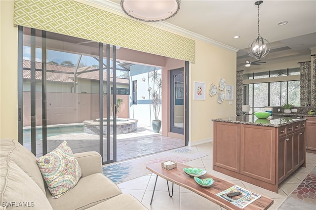 living room with ornamental molding and light tile patterned floors