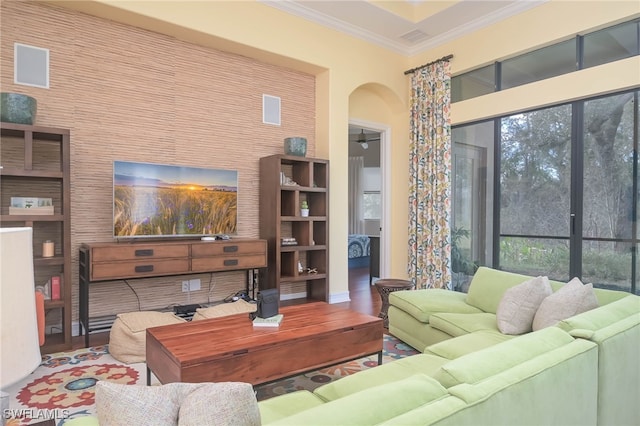 living room featuring hardwood / wood-style flooring and ornamental molding