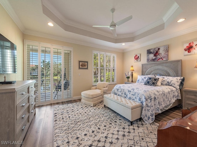 bedroom with light hardwood / wood-style floors, ornamental molding, access to exterior, and ceiling fan