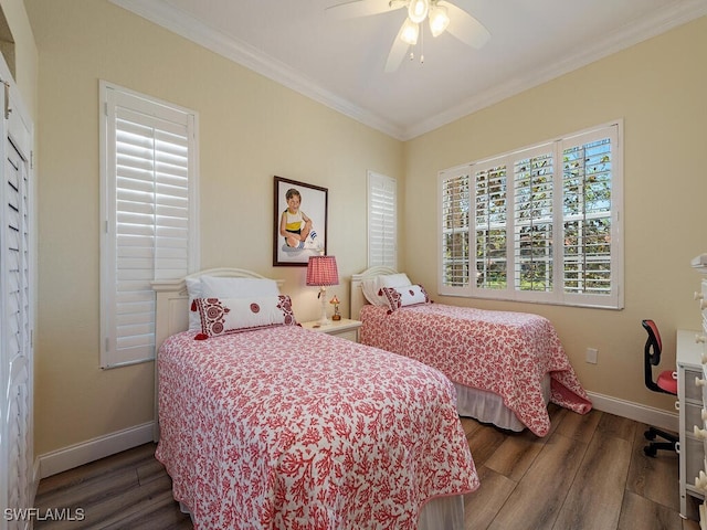 bedroom featuring crown molding, ceiling fan, and dark hardwood / wood-style flooring