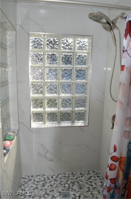 bathroom with curtained shower