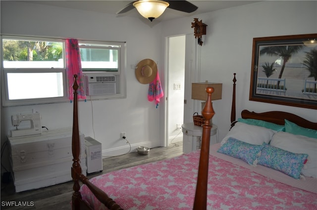 bedroom with cooling unit, hardwood / wood-style flooring, and ceiling fan