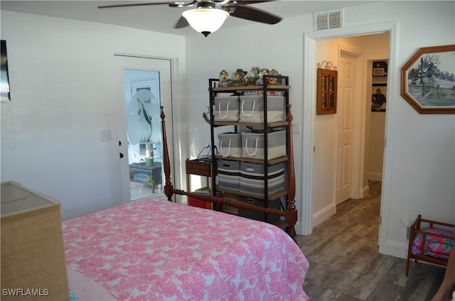 bedroom featuring dark hardwood / wood-style flooring and ceiling fan