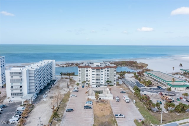 birds eye view of property featuring a water view and a view of the beach