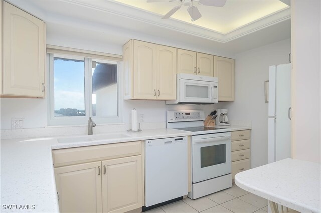 6900 Estero Blvd Unit 701, Fort Myers Beach, FL 33931 - kitchen featuring a sink, light countertops, cream cabinets, and white appliances