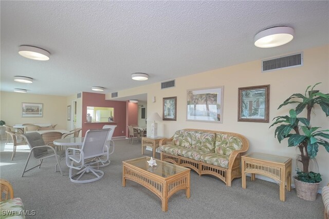 6900 Estero Blvd Unit 701, Fort Myers Beach, FL 33931 - living room with a textured ceiling, visible vents, and carpet