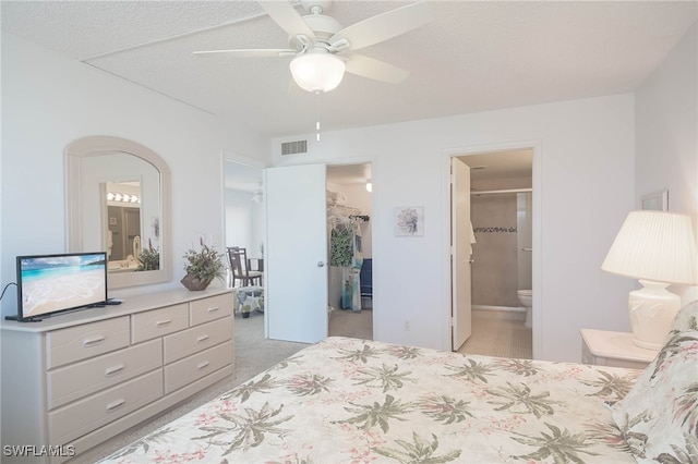 6900 Estero Blvd Unit 701, Fort Myers Beach, FL 33931 - bedroom featuring a closet, a ceiling fan, a spacious closet, arched walkways, and ensuite bath
