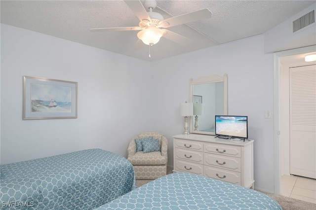 6900 Estero Blvd Unit 701, Fort Myers Beach, FL 33931 - bedroom featuring visible vents, a textured ceiling, ceiling fan, and tile patterned floors