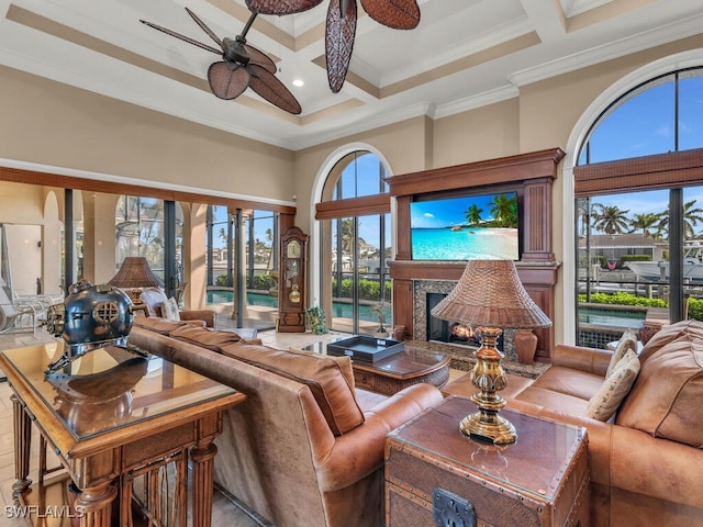 living room with a high ceiling, coffered ceiling, beamed ceiling, crown molding, and a fireplace