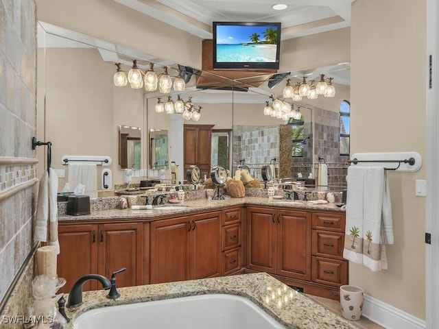 bathroom featuring vanity, plenty of natural light, and ornamental molding