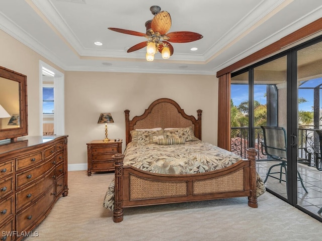 bedroom featuring ornamental molding, access to outside, a raised ceiling, ceiling fan, and light colored carpet