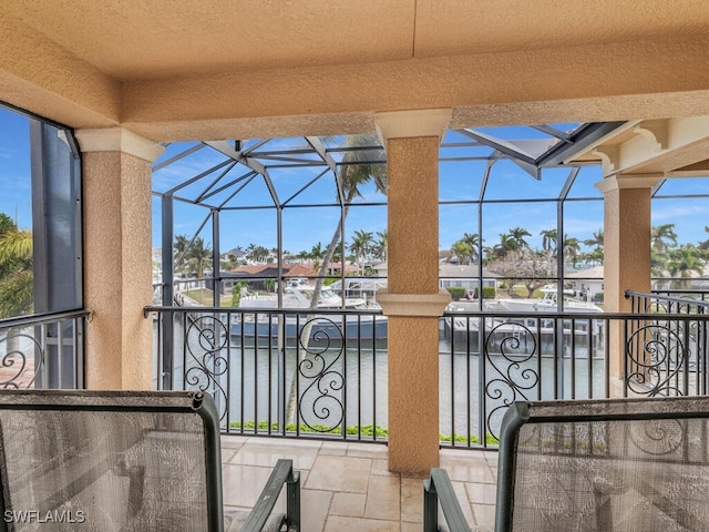 view of patio with glass enclosure