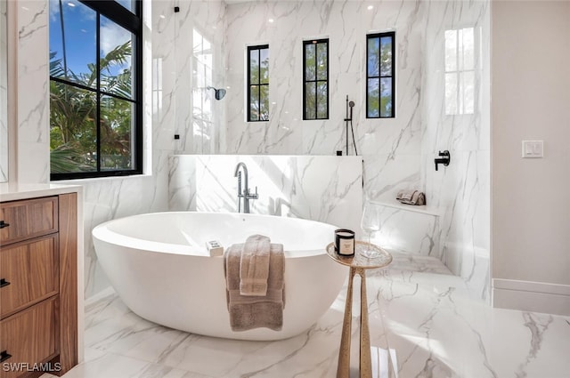 bathroom with vanity, tile walls, and plus walk in shower