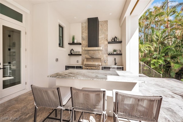 view of patio featuring grilling area and exterior kitchen