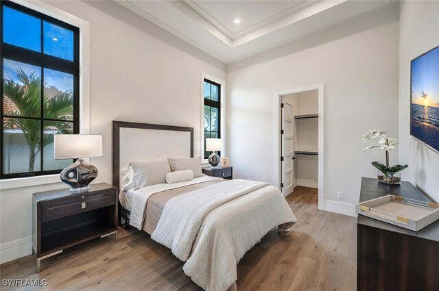 3540 Crayton Rd, Naples, FL 34103 - bedroom featuring wood finished floors and baseboards